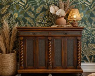 Theodore Alexander Armoury Collection Sideboard Barley-twist columns, foliate metal panels, and paw feet make this a striking statement piece. 