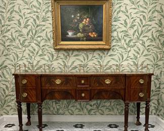 An absolutely superb Maitland-Smith sideboard featuring a striking brass gallery and rich figured mahogany veneers. Elegant proportions with fine brass hardware and classic craftsmanship make this a statement piece for dining room or entry. A beautiful example of Maitland-Smith’s renowned quality and timeless style.
