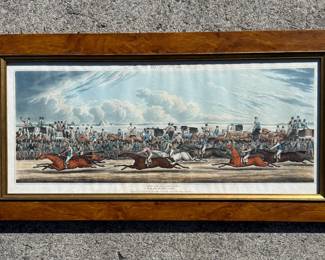 Early 19th Century English Horse Racing Print – Newmarket Races Rare antique sporting print titled “Newmarket”, after a painting by Henry Alken, engraved by Charles Hunt, circa 1820. This lively racing scene captures the excitement of the famous Newmarket course with jockeys mid-race and crowds cheering from carriages and stands. Hand-colored engraving presented in a handsome burl wood frame. A classic piece of English sporting art and equestrian history perfect for a library, study, or sporting collection