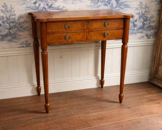 Classic wooden console table with two drawers, turned legs, and warm traditional finish. Perfect as an entry table, writing desk, or accent piece. Timeless style that works beautifully with traditional, French country, or classic interiors.