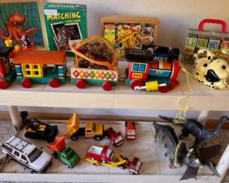 1963 Fisher-Price Huffy Puffy Train Set, SuperToys Light ‘Em Up ‘n Sound Dog Flashlight, 1950s German Wooden Blocks, Matchbox 2000 Chevy Suburban - Mesa Fire Battalion Chief Fire Truck Toy, Buddy L Dump Truck Toy