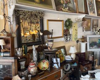 lots of beautiful artwork of all kinds, birds, oil paintings, ginger jar, decorative plates antique furniture