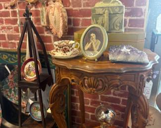 wooden side table, shelf, frames, tea cup and saucers