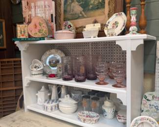 pink and lavender glassware, unique photo frames, candlesticks, cook books