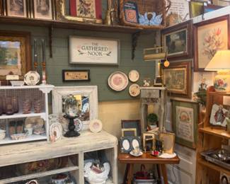 antique table, heart shaped pans, framed artwork, dishes