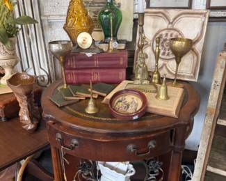 vintage side table with drawers, art, vases, vintage books, wall hangings