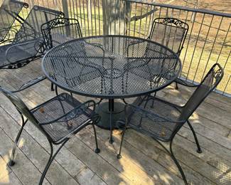 one of 2 metal mesh patio tables and 4 chairs