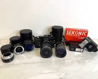 Lot 328 Vintage Minolta XE7 Film Camera  Camera Lenses  More