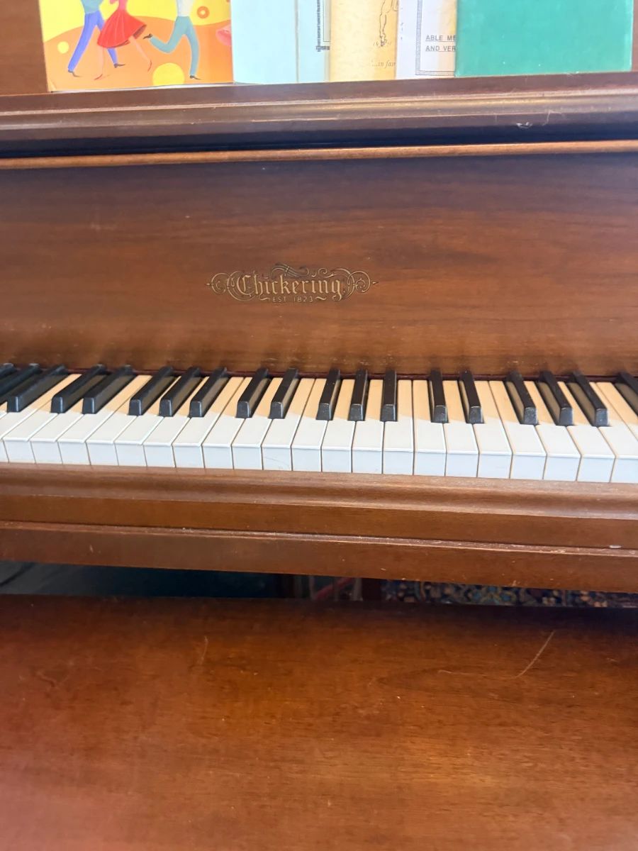 Baby grand piano, wood upright keyboard, vintage musical instrument, ivory keys, living room furniture