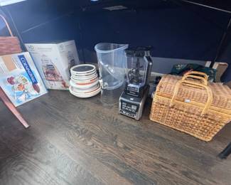 Wicker picnic basket and kitchen items