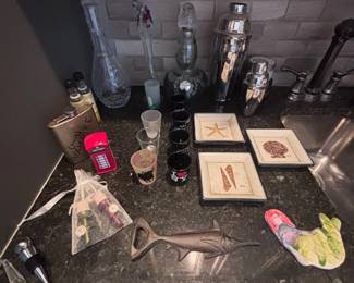 Barware, cocktail shaker, decanters, and brass marlin