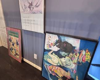 Framed festival posters and art