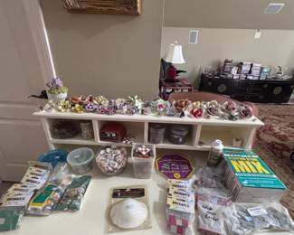 Mosaic craft supplies, porcelain flower figurines, white cubby shelf