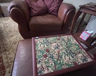Leather armchair and needlepoint ottoman