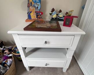 Collectible figurines on side table