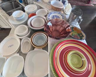 Assorted dinnerware and colored glass