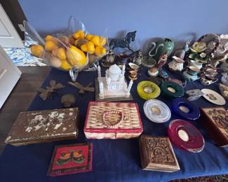 Assorted collectibles, figurines, and decorative boxes