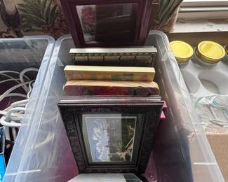 Assorted picture frames and candles