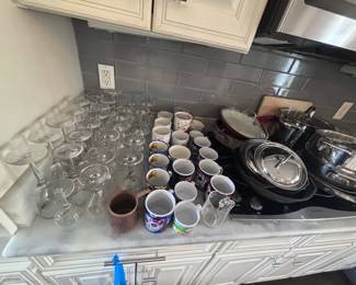 Stemware, mugs, and silver serving dishes