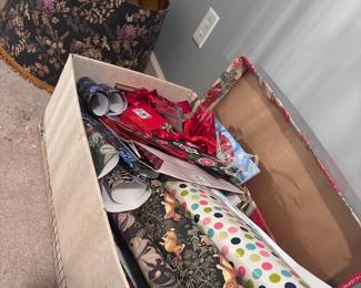 Gift wrapping paper rolls, gift bags, decorative storage hat box