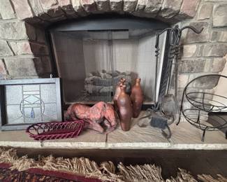 Stone fireplace with screen and tools