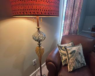 Glass base table lamp with red shade