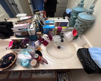 Bathroom vanity toiletries, beauty products, quilted handbag, personal care items