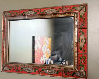 Peruvian reverse-painted glass wall mirror, red floral frame