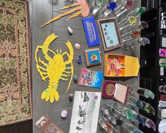 Vintage glass bottles, metal lobster art, crystals, collectibles