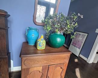 Wood storage cabinet and arched wall mirror