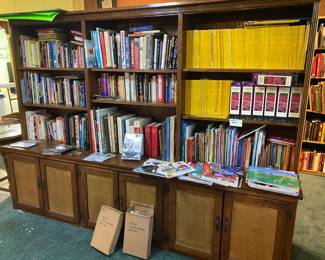 Books, books and more books. And is beautiful wall length cabinet is also for sale.