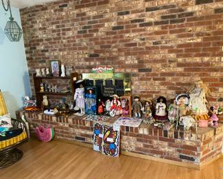 Porcelain dolls, collectible cat figurines, and more