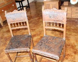 pair Renaissance Revival Henri II embossed leather chairs