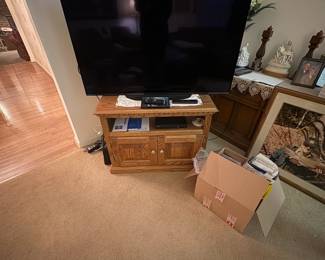 . . . another flat-screen and TV stand