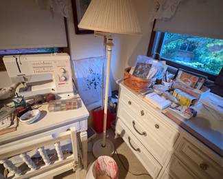 . . . standing lamp and white dresser and a Husqvarna sewing machine