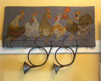 Brass horns, embroidered chickens 