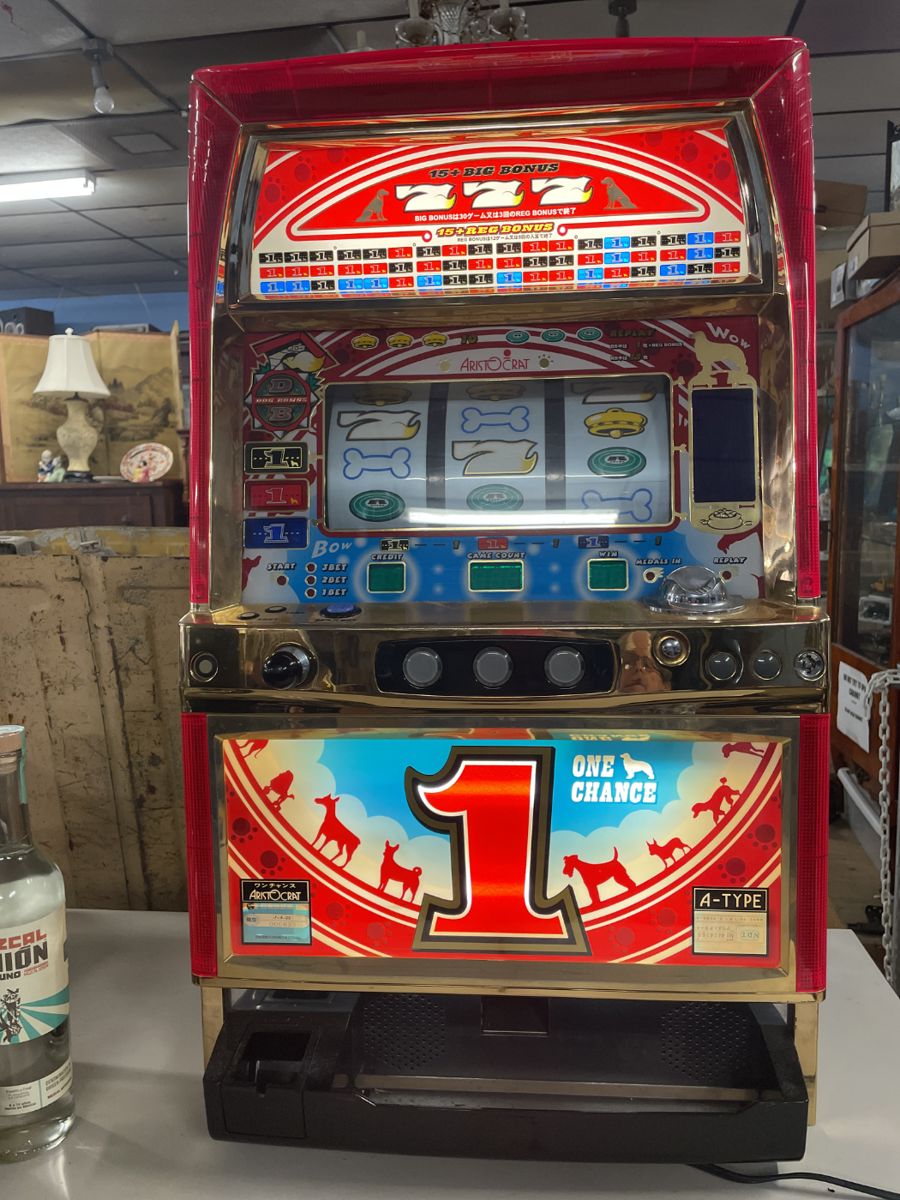 Working slot machine with keys and coins