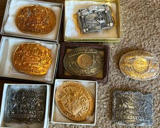 Several Hesston belt buckles