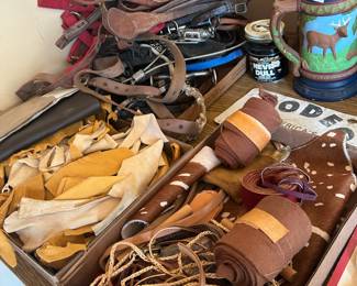 Leather pieces, horse bridles,
Ropes