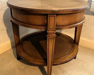 Small round wood table. 24" Dia. x 21 1/2" H.