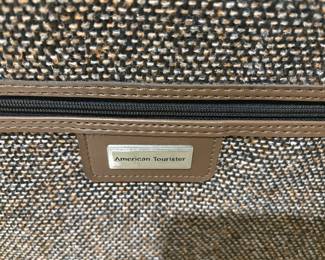 American Tourister logo on bag 