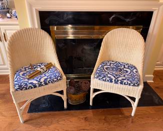 Two matching wicker chairs
