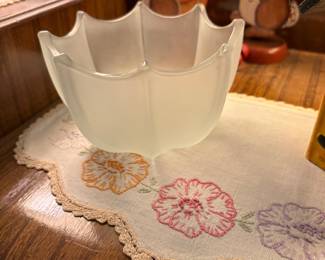Large glass bowl in middle portion of dress with hand embroidered scarf 