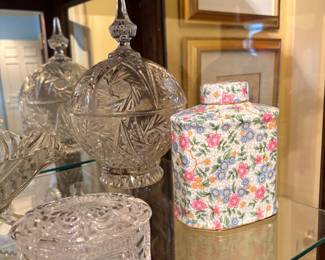Entrance hallway - items in Curio Cabinet
Cut glass Covered  dish, in front , candy fish with lid in back & metal flowered container 