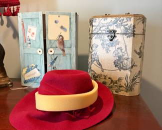 Master bedroom - top of chest - Red hat, 2 decorative items 