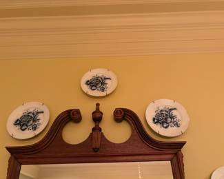 Platters on wall in dining room 