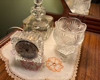 Bedroom - embroidered scarf on dresser with glass enclosed clock 