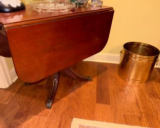 Close up of drop leaf (2sides) table & small wastebasket 