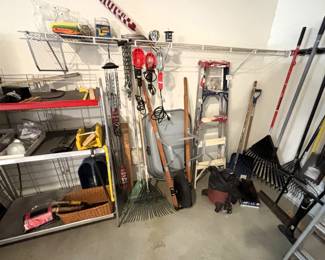 Wheel barrow, garden tools and equipment.