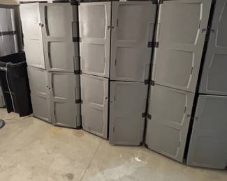 Large plastic storage cabinets with shelves.